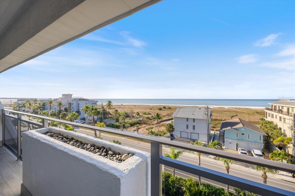 625 Beach Road, Unit 602 Sarasota, FL 34242 - Photo 7 of 65 a view of a city from a balcony with furniture