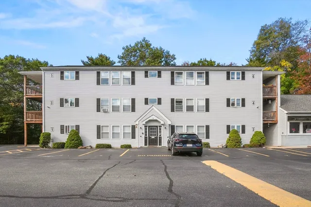 a view of multiple houses with a street