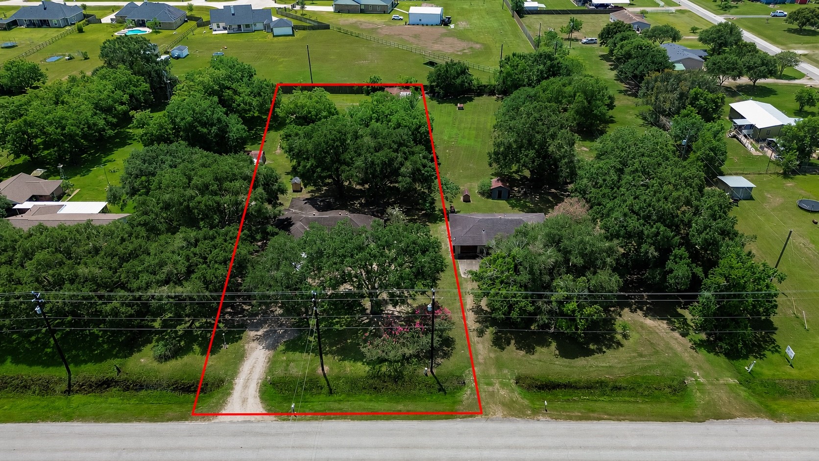 11105 Needville Fairchilds Road Needville, TX 77461 - Photo 2 of 24 an aerial view of a house with a yard