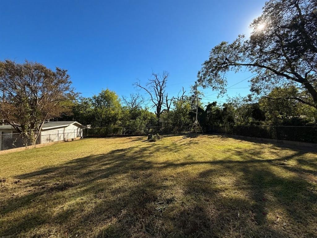 1512 West Day Street Denison, TX 75020 - Photo 14 of 14 a view of a yard with a house