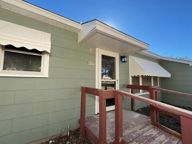 a view of livingroom with furniture and a window