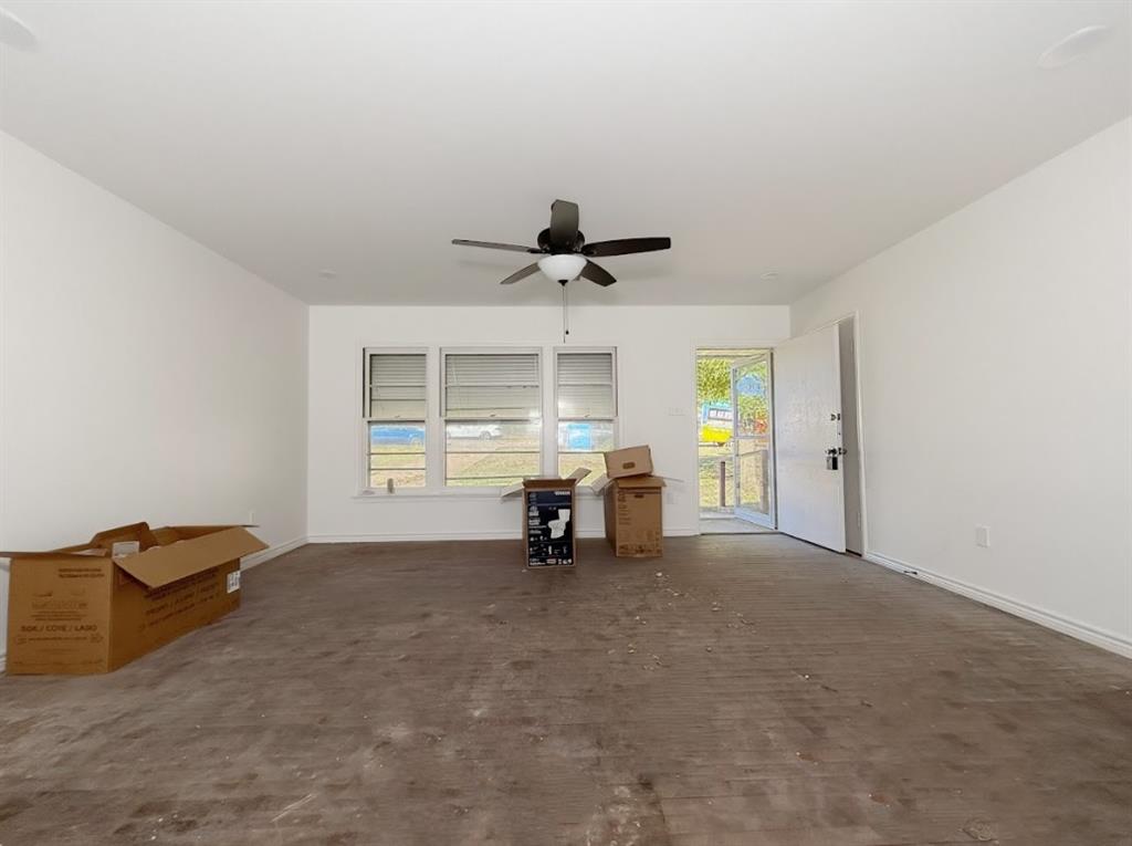 1512 West Day Street Denison, TX 75020 - Photo 4 of 14 a view of livingroom with furniture and a window