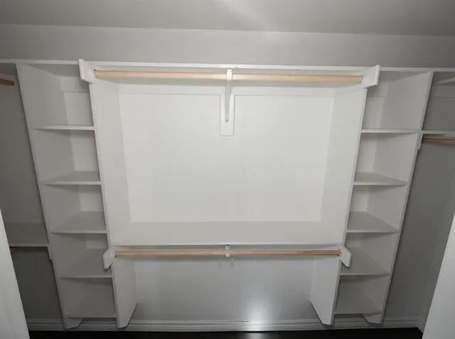 a bathroom with a granite countertop toilet a sink and a mirror