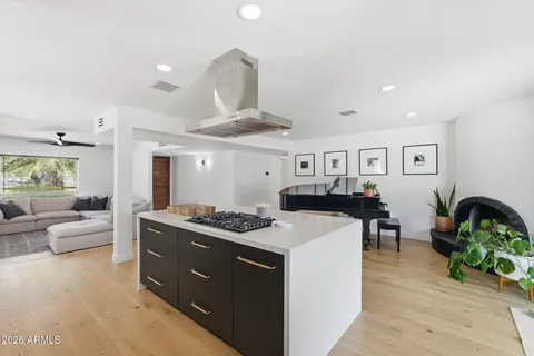 a kitchen with a refrigerator stove and sink
