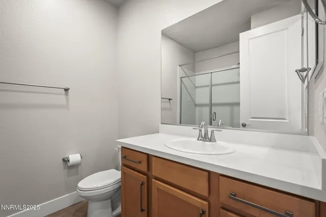 a bathroom with a sink toilet and vanity