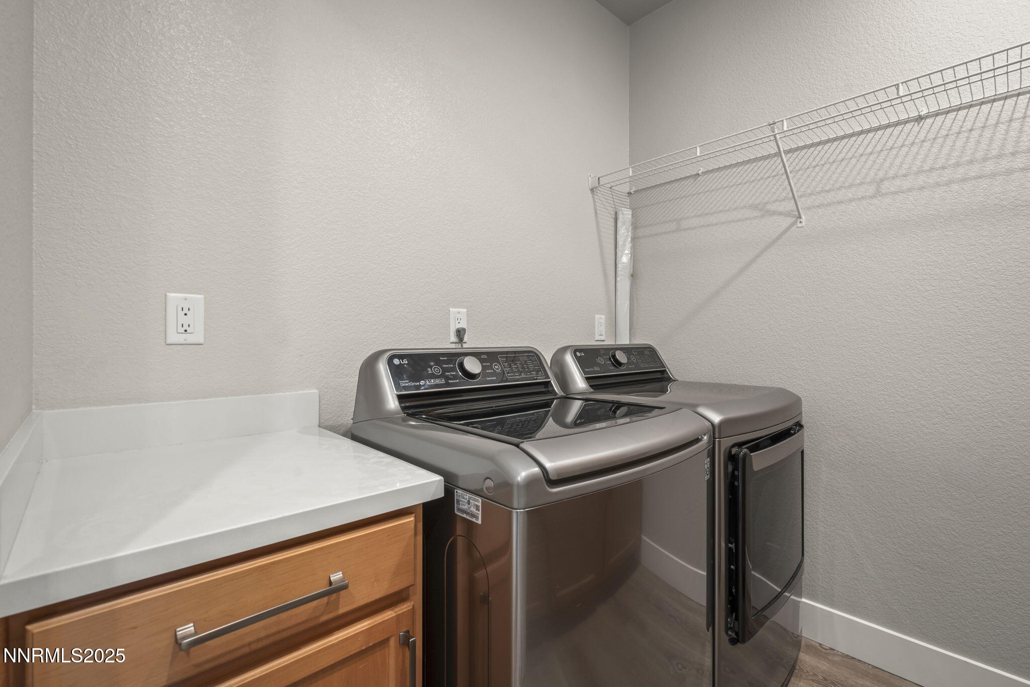 7726 Enclave Key Road Reno, NV 89506 - Photo 17 of 25 a utility room with dryer and washer