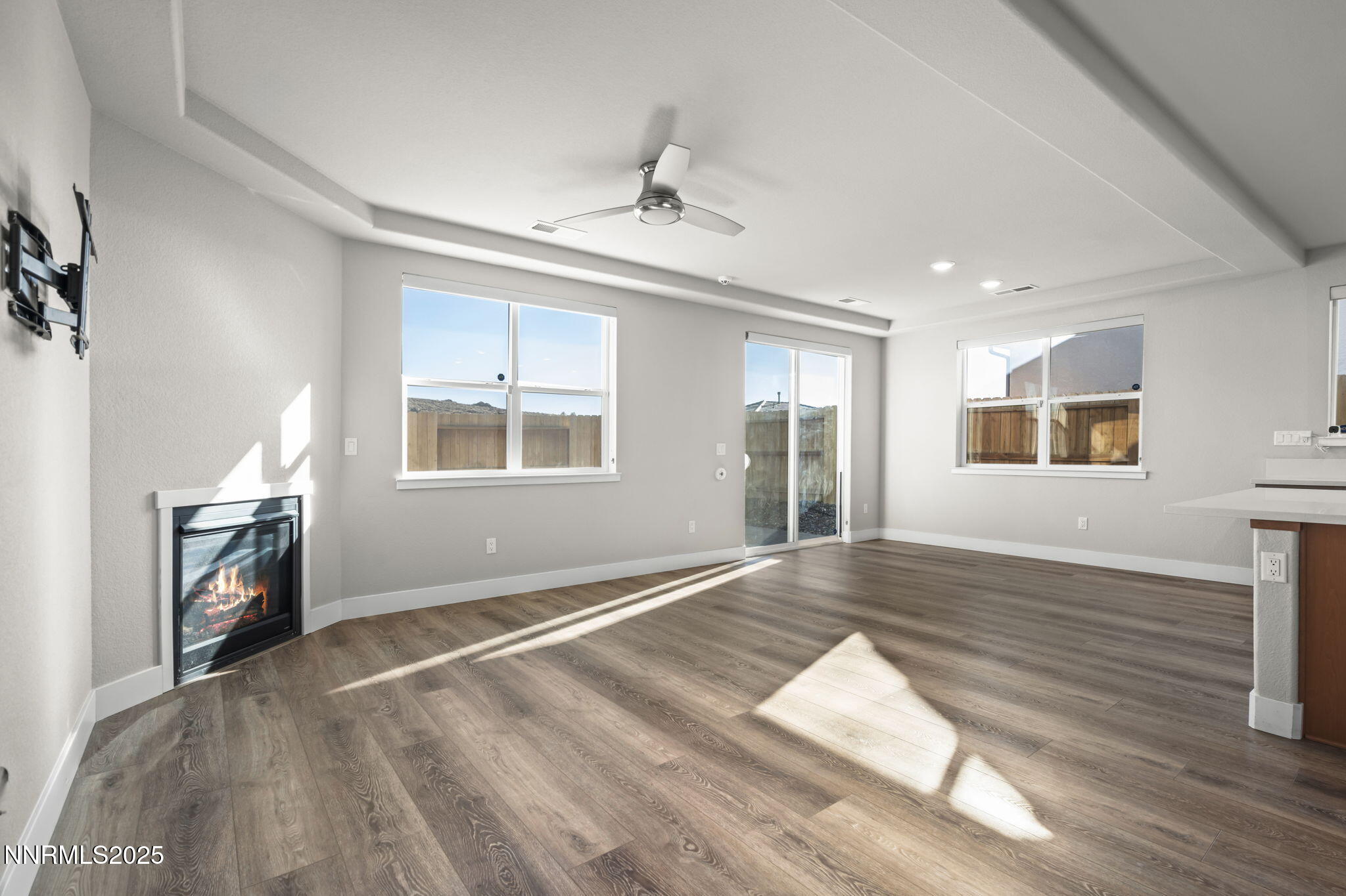 7726 Enclave Key Road Reno, NV 89506 - Photo 2 of 25 a view of empty room with wooden floor and fan