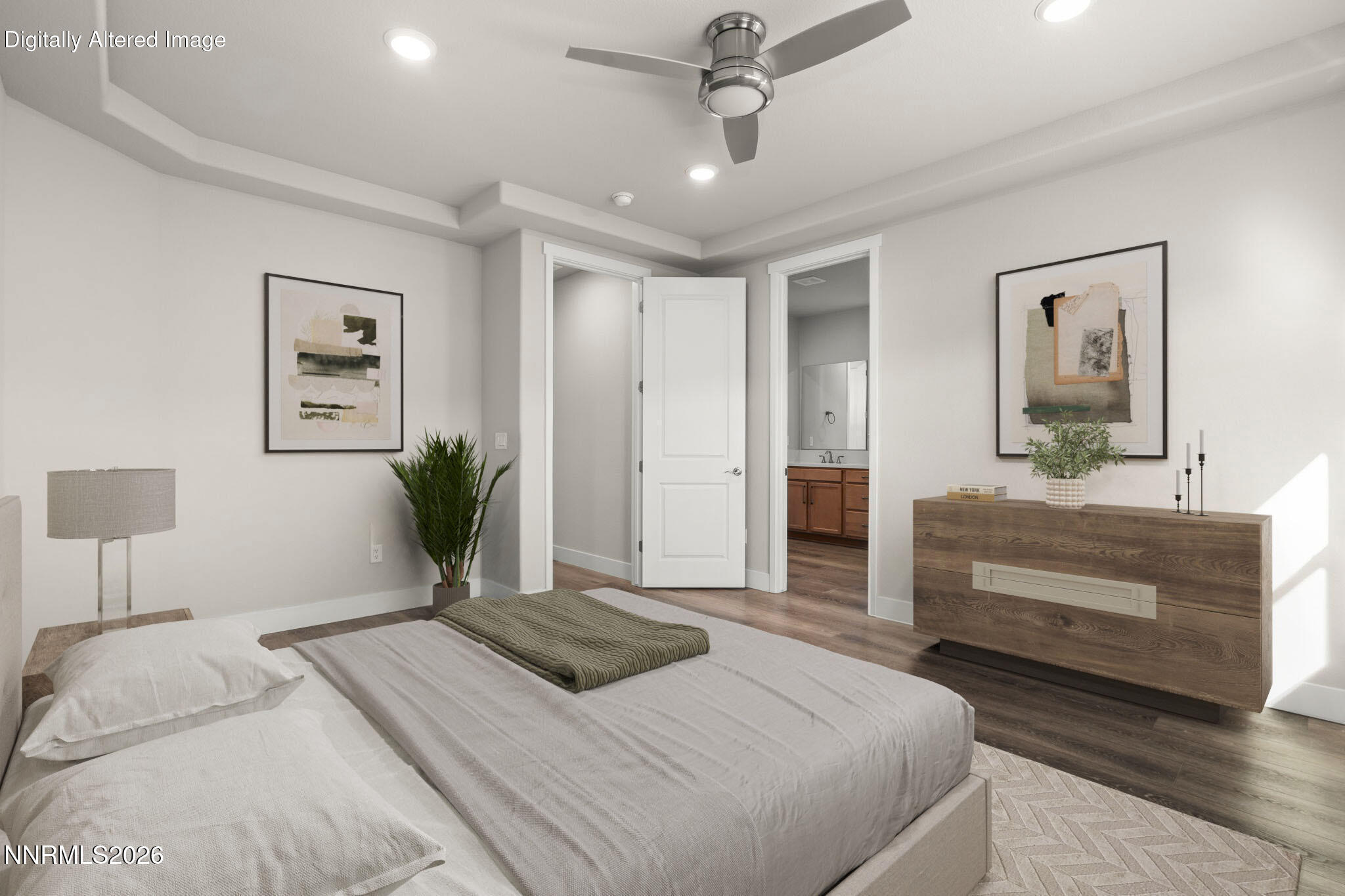 7726 Enclave Key Road Reno, NV 89506 - Photo 21 of 25 a bedroom with a large bed and a chandelier