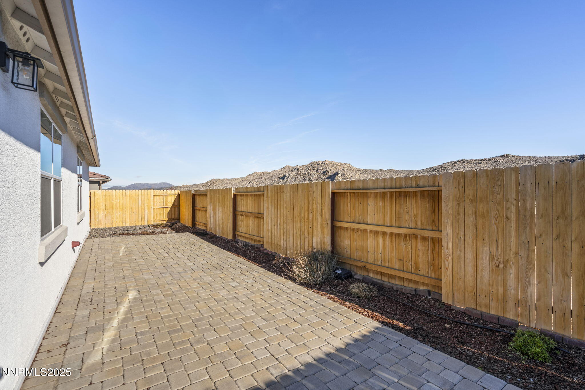 7726 Enclave Key Road Reno, NV 89506 - Photo 22 of 25 a view of a house with a backyard