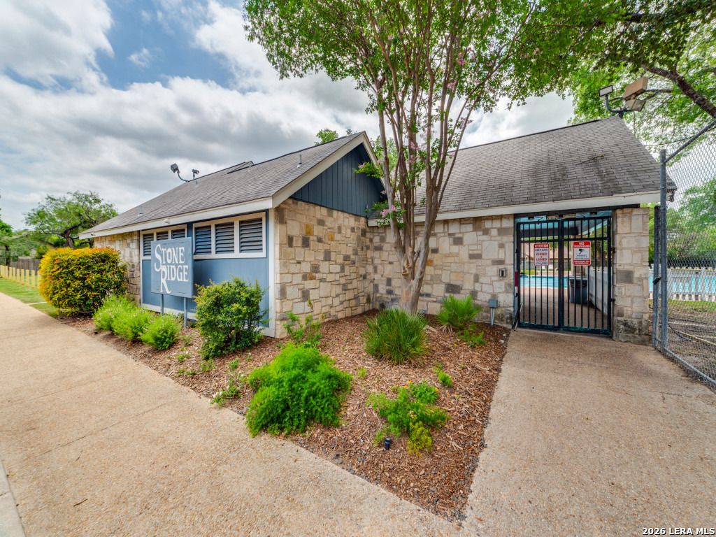 3439 Ridge Ranch San Antonio, TX 78247 - Photo 22 of 25 front view of a house with a pathway