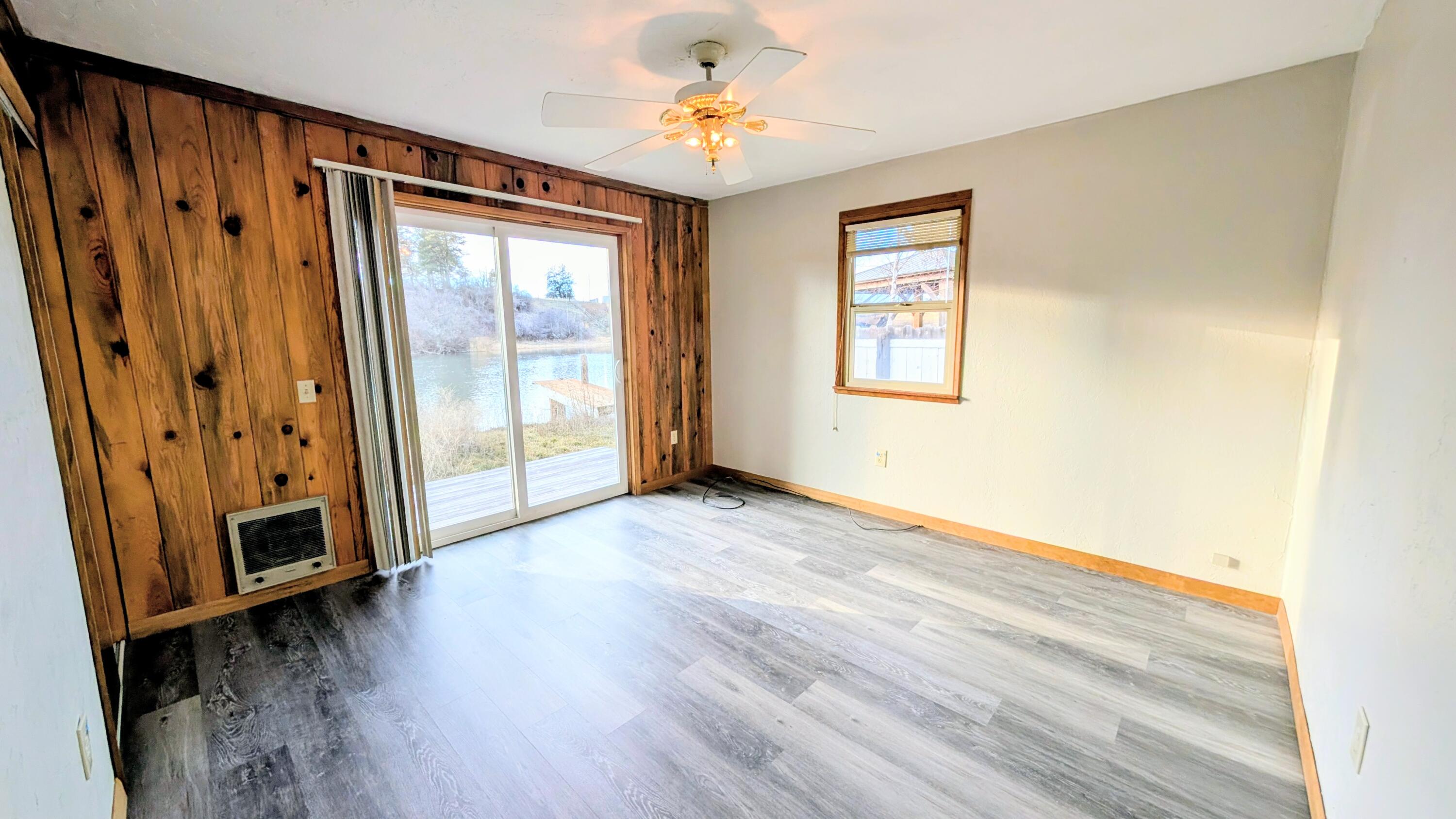 32550 Rivers Drive Chiloquin, OR 97624 - Photo 12 of 24 a view of an empty room with window and wooden floor