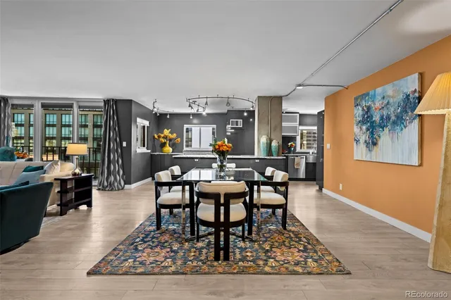 a living room with furniture a rug and a large window