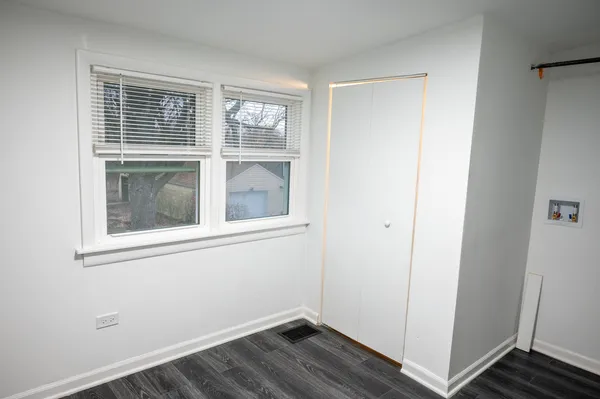 a view of empty room with windows