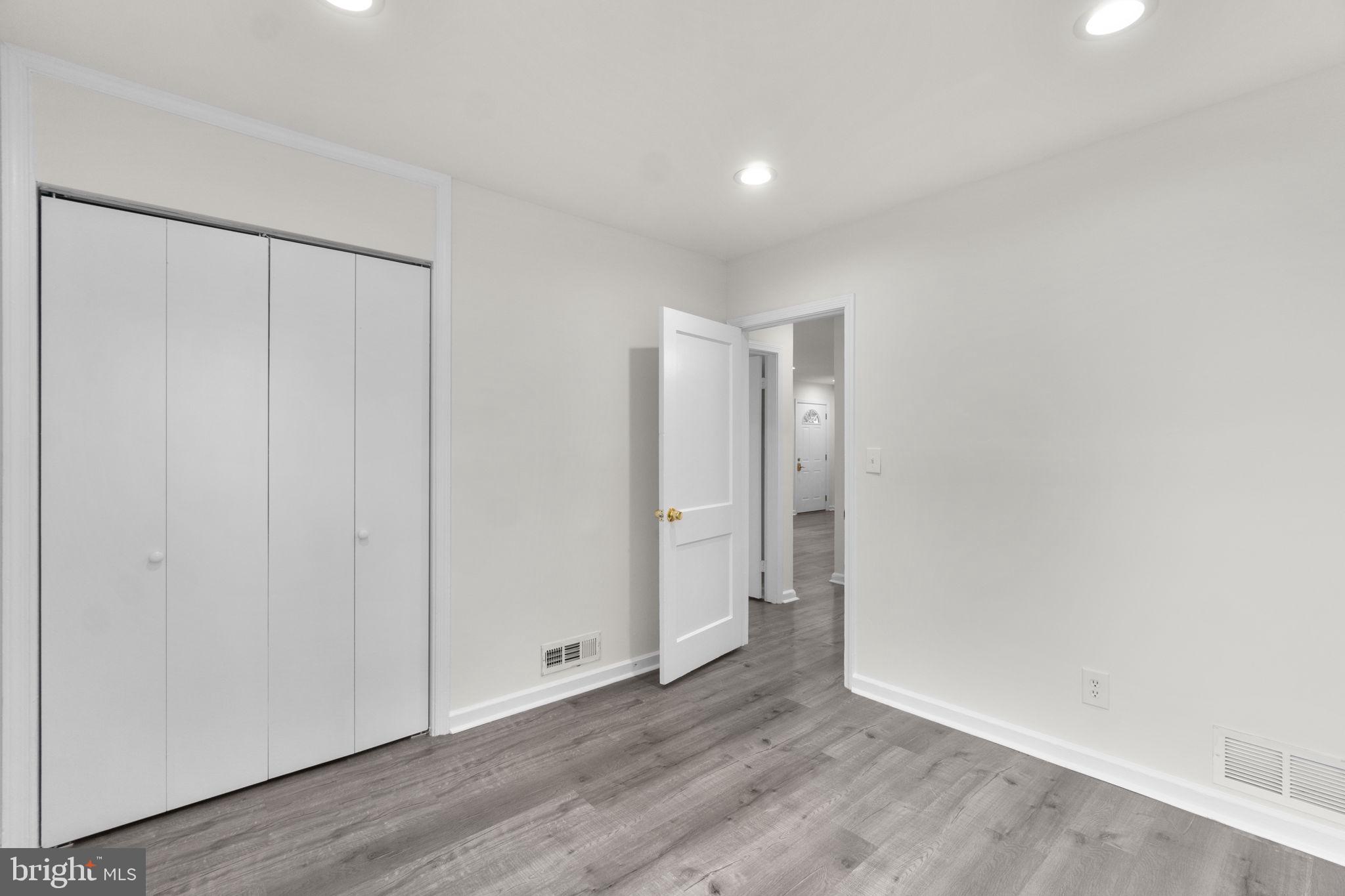 3658 Clifmar Road Baltimore, MD 21244 - Photo 27 of 43 a view of an empty room with wooden floor