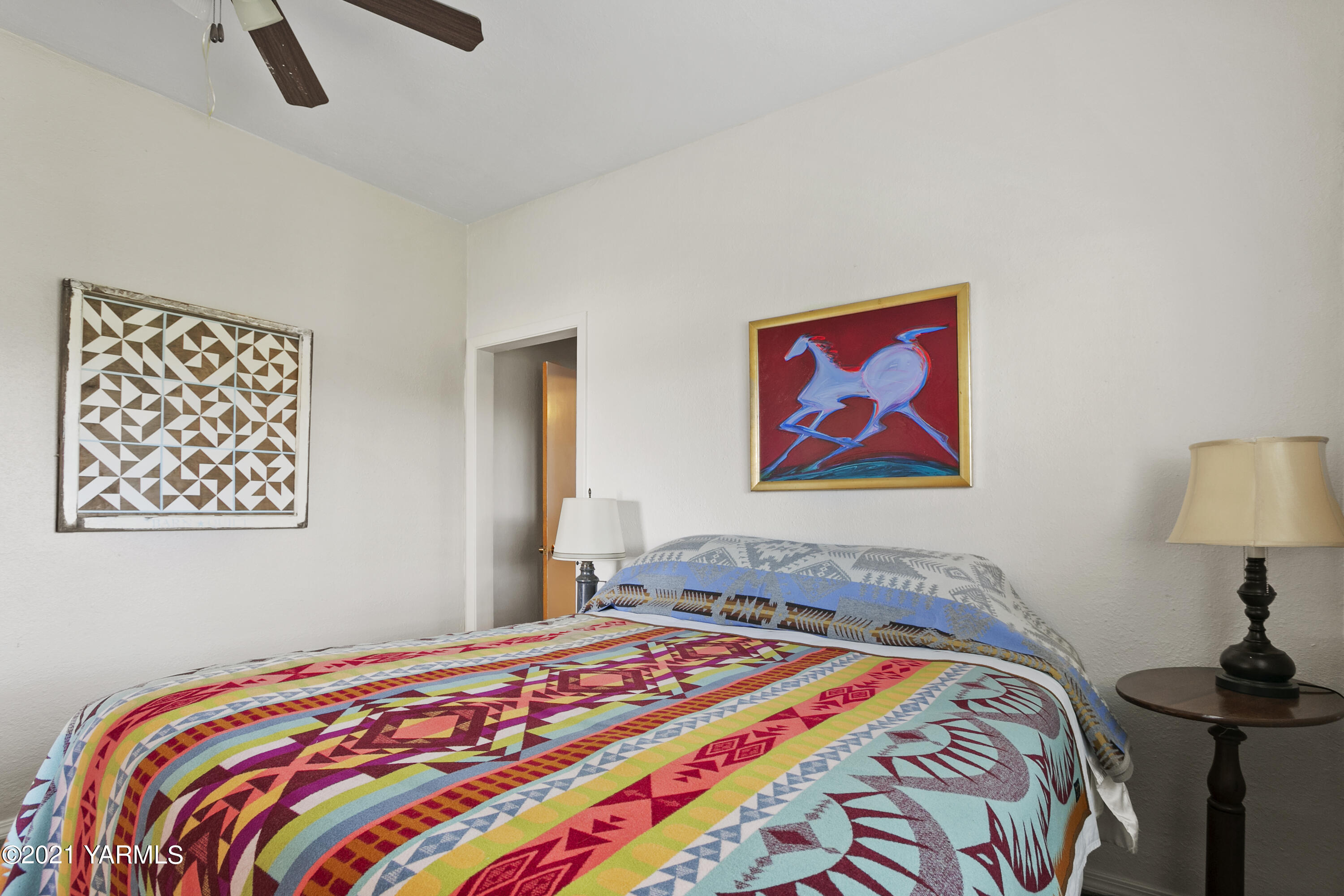 4171 Sheller Road Sunnyside, WA 98944 - Photo 10 of 28 a bedroom with bed and painting on the wall