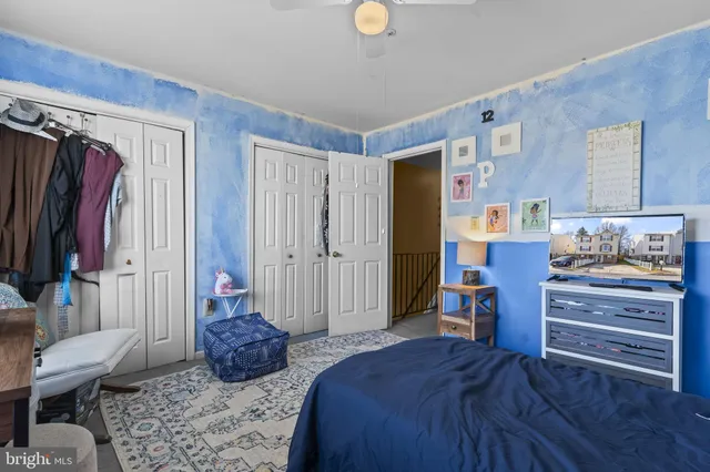 a bedroom with a bed and furniture