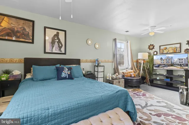 a bedroom with a bed and furniture