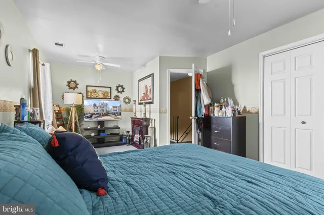 a bed room with a bed and a television