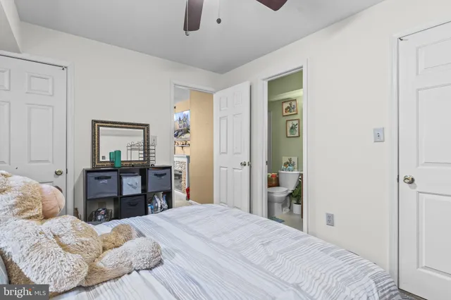 a bedroom with a bed and a dresser in it