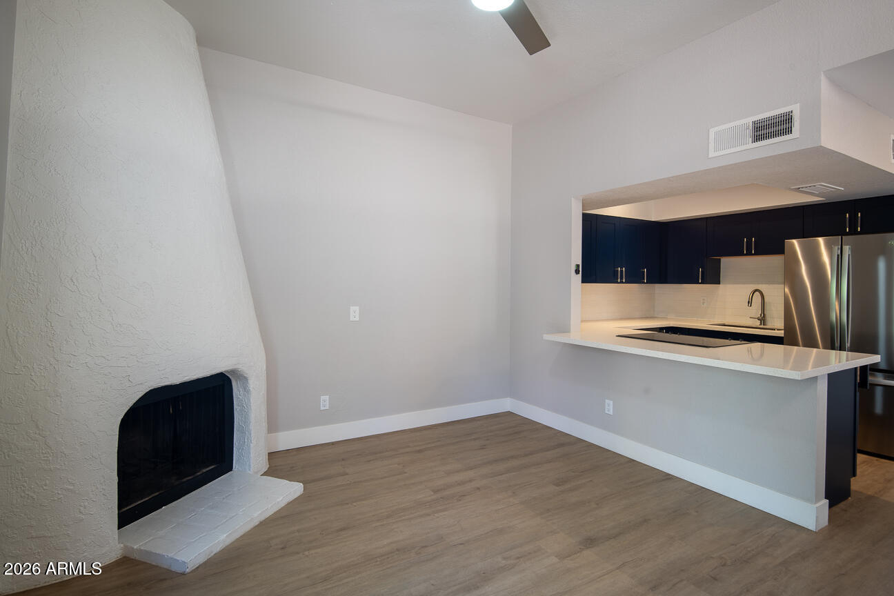 4540 North 44th Street, Unit 50 Phoenix, AZ 85018 - Photo 4 of 31 a view of kitchen with microwave and sink