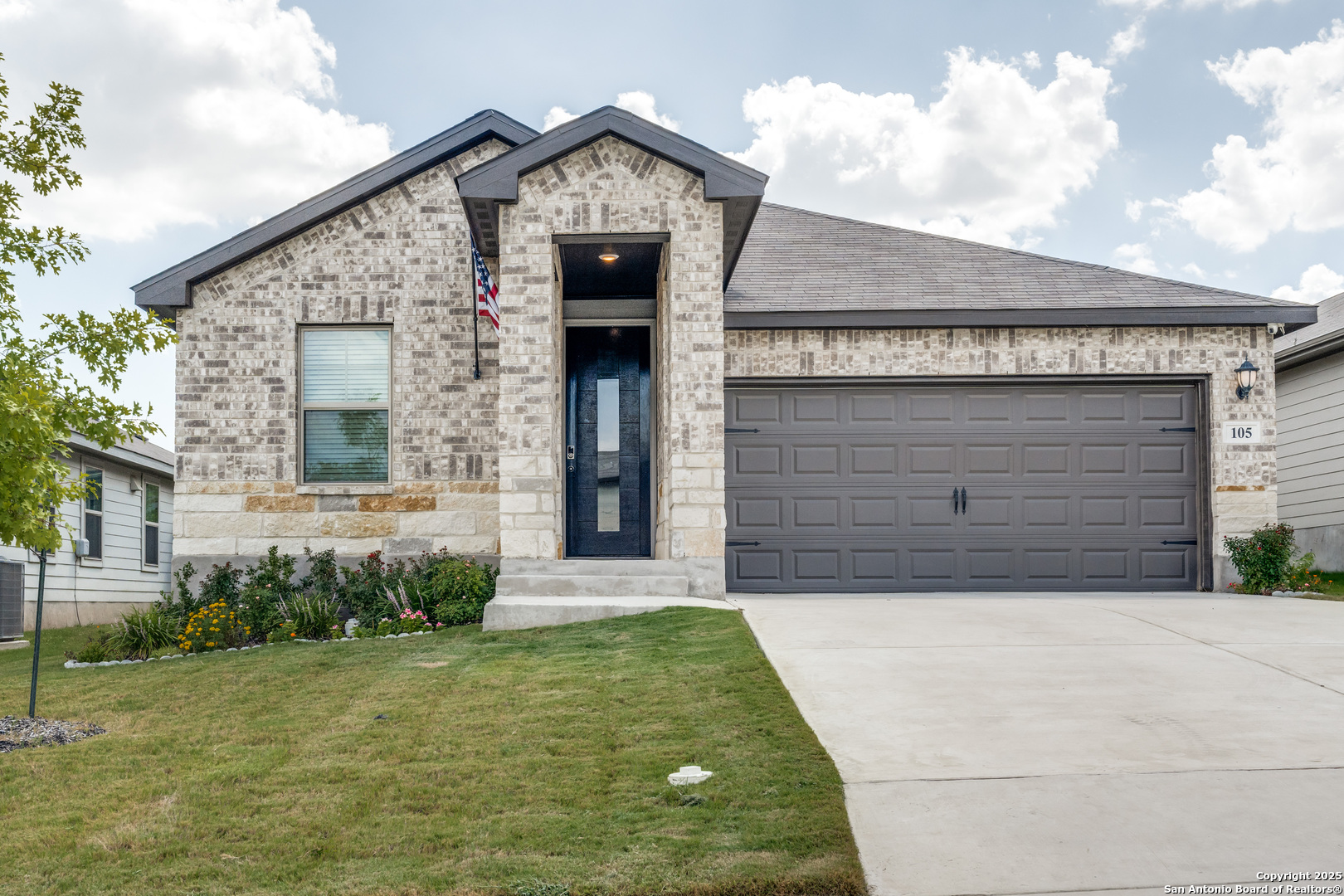 a front view of a house with garden