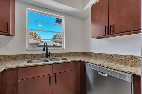 a kitchen with a sink and cabinets