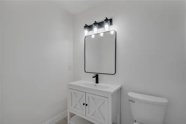 a bathroom with a sink and mirror