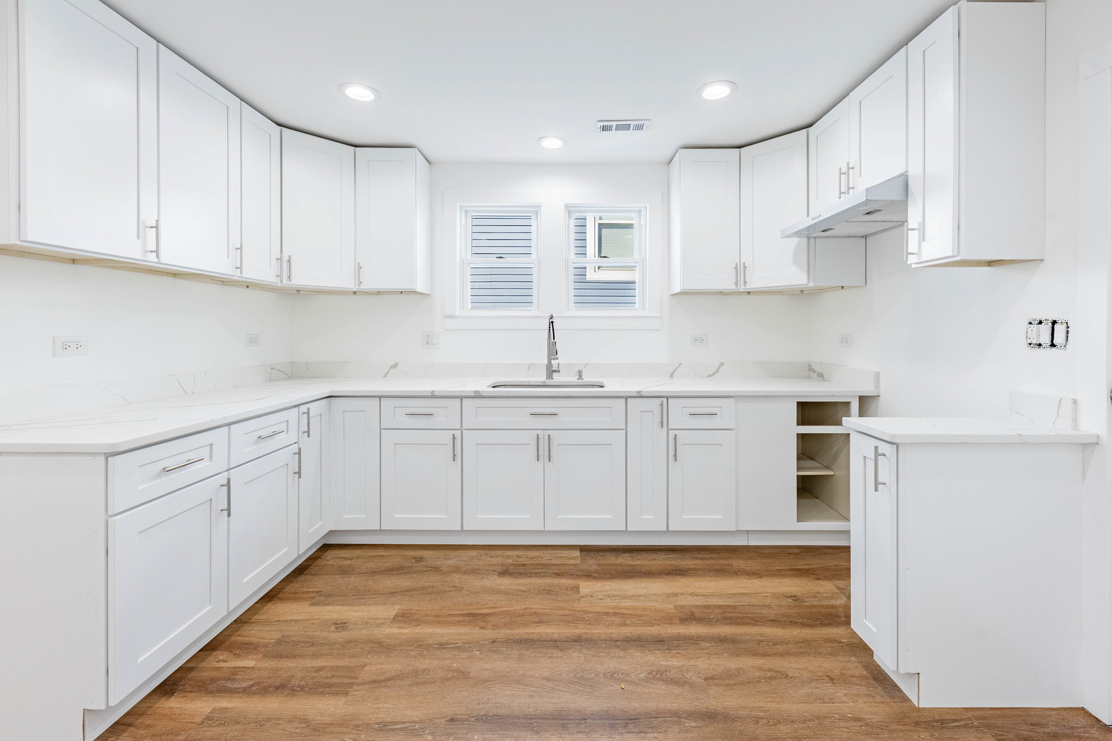1719 North Merrimac Avenue Chicago, IL 60639 - Photo 20 of 35 a kitchen with granite countertop white cabinets and white appliances
