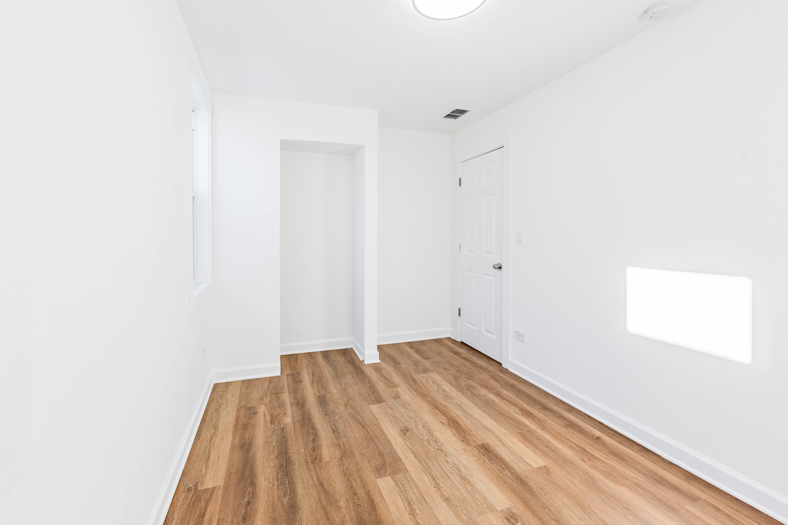 1719 North Merrimac Avenue Chicago, IL 60639 - Photo 27 of 35 a view of a room with wooden floor