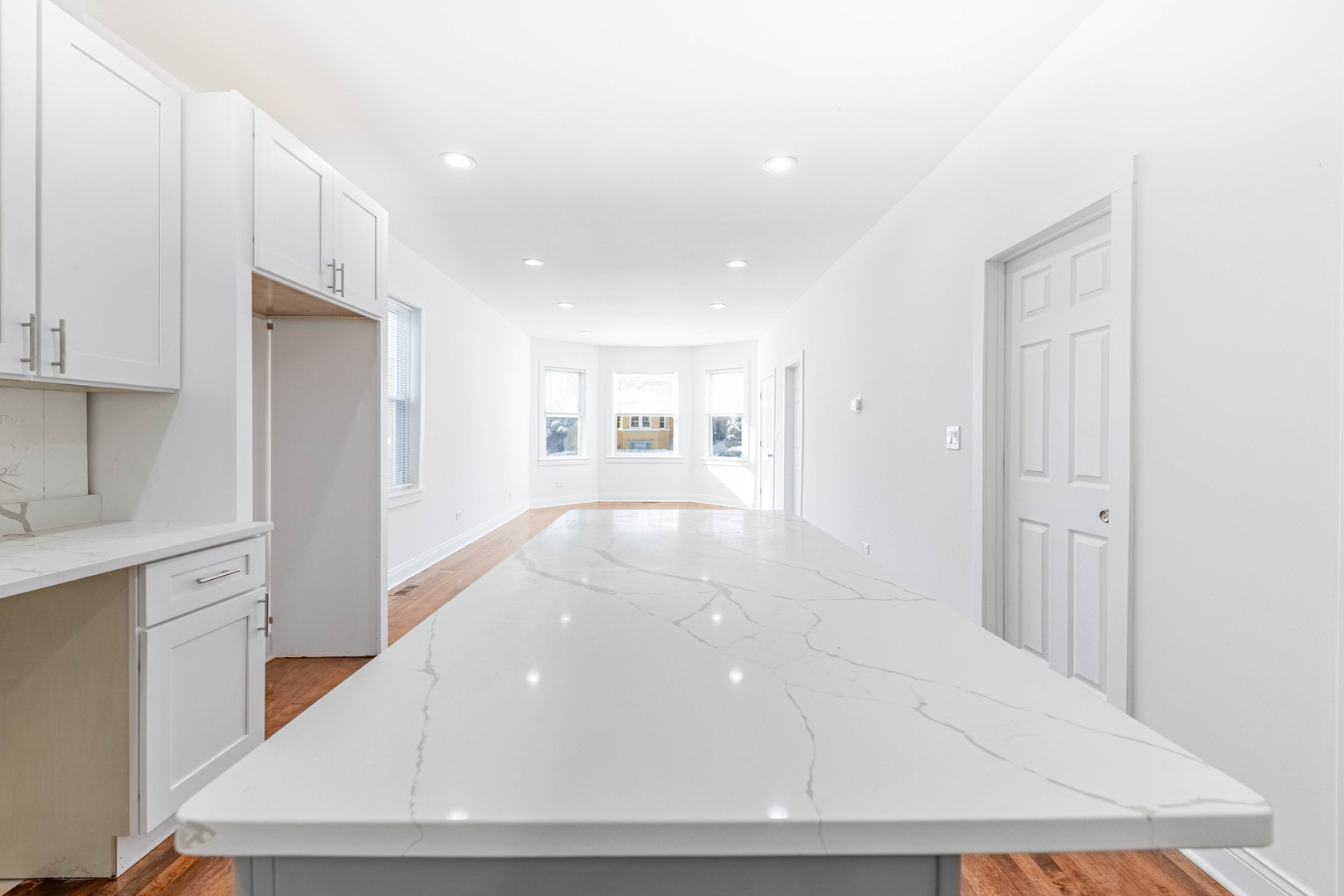 1719 North Merrimac Avenue Chicago, IL 60639 - Photo 10 of 35 a view of a kitchen with a refrigerator and cabinets