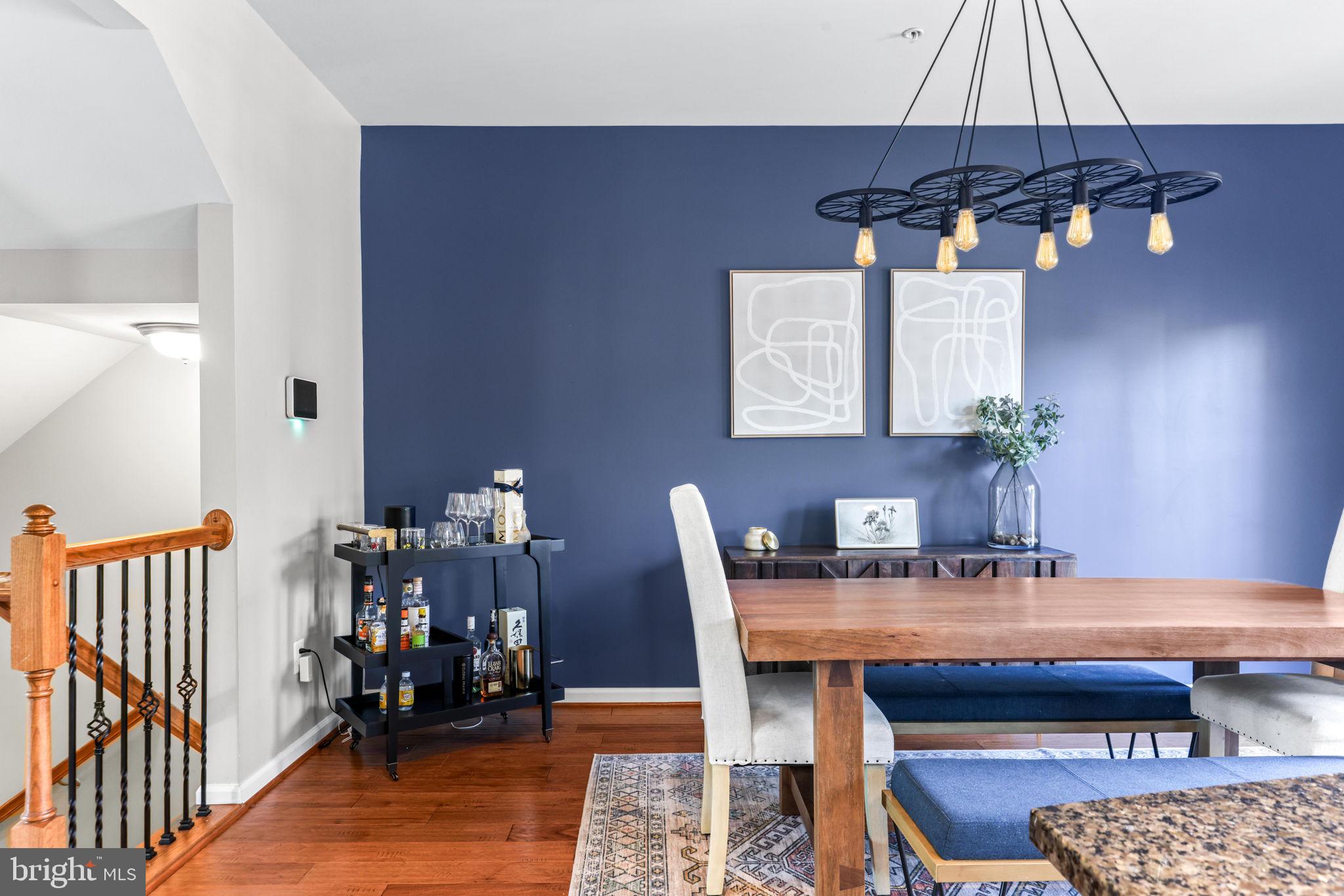 4648 Hudson Street Baltimore, MD 21224 - Photo 15 of 46 a dining room with furniture and chandelier