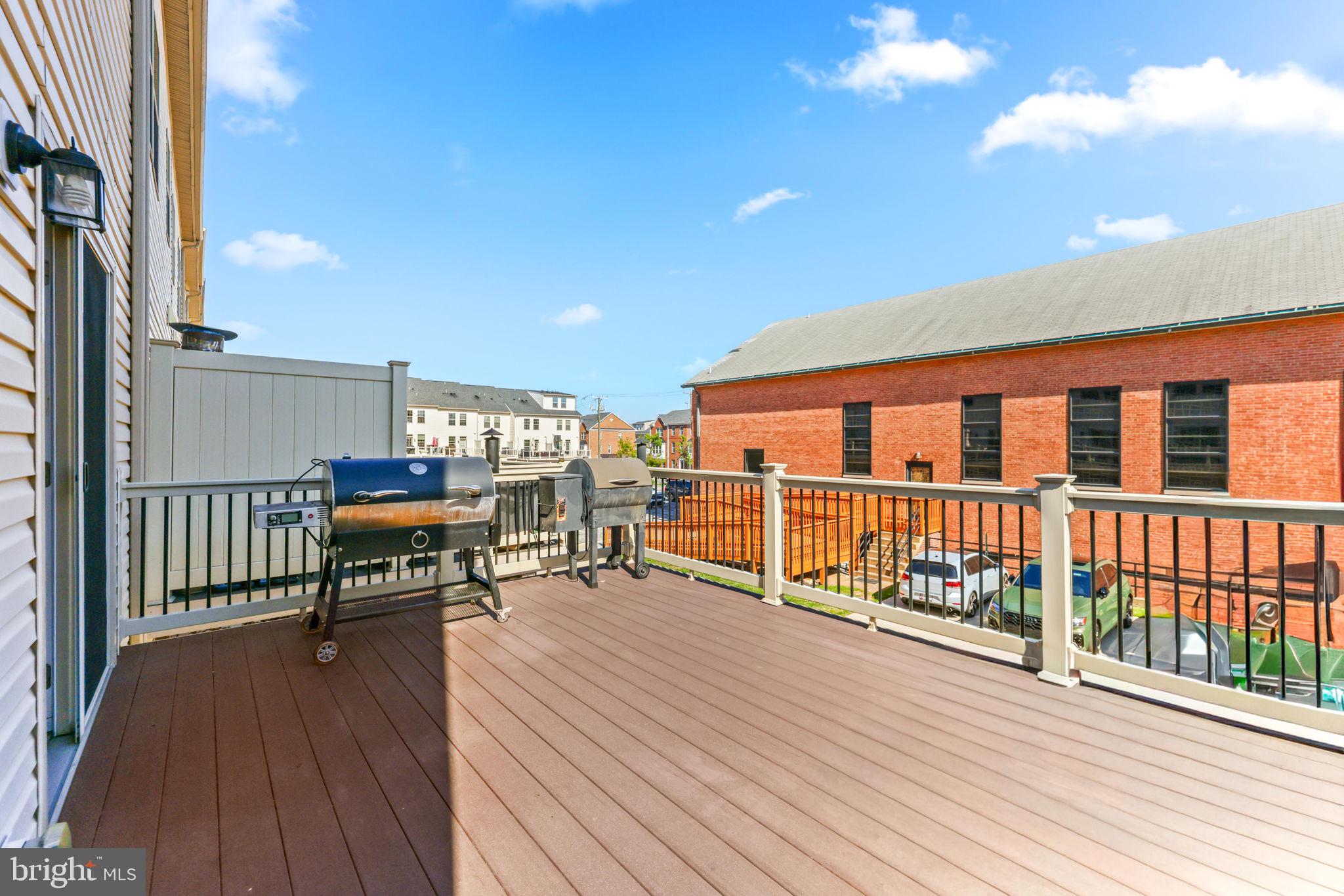 4648 Hudson Street Baltimore, MD 21224 - Photo 17 of 46 a balcony with furniture and wooden floor