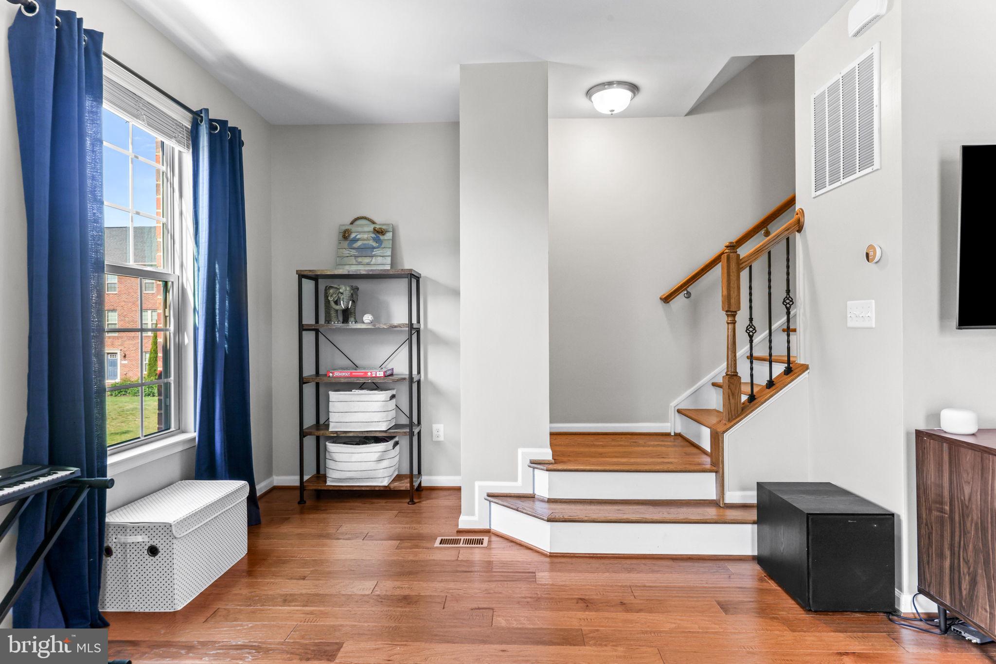 4648 Hudson Street Baltimore, MD 21224 - Photo 24 of 46 a view of entryway bedroom and hall with wooden floor