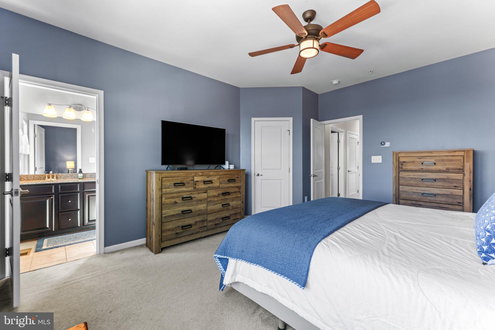 4648 Hudson Street Baltimore, MD 21224 - Photo 27 of 46 a bedroom with a bed and a flat screen tv