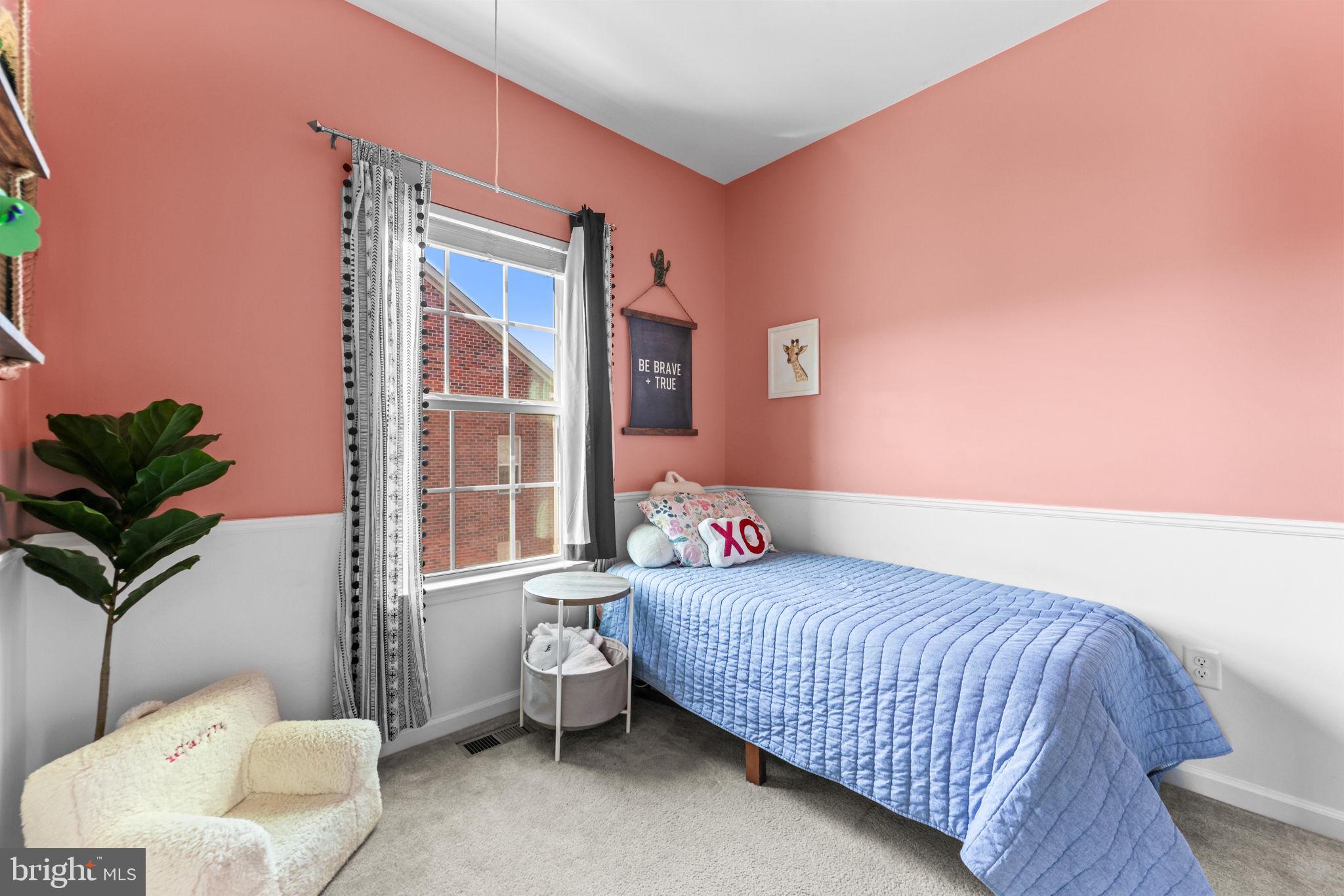 4648 Hudson Street Baltimore, MD 21224 - Photo 30 of 46 a bedroom with a bed and a window