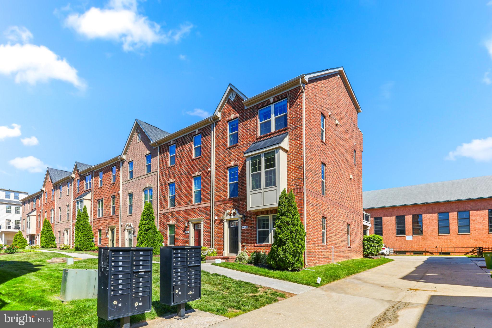 4648 Hudson Street Baltimore, MD 21224 - Photo 3 of 46 a front view of a residential apartment building with a yard
