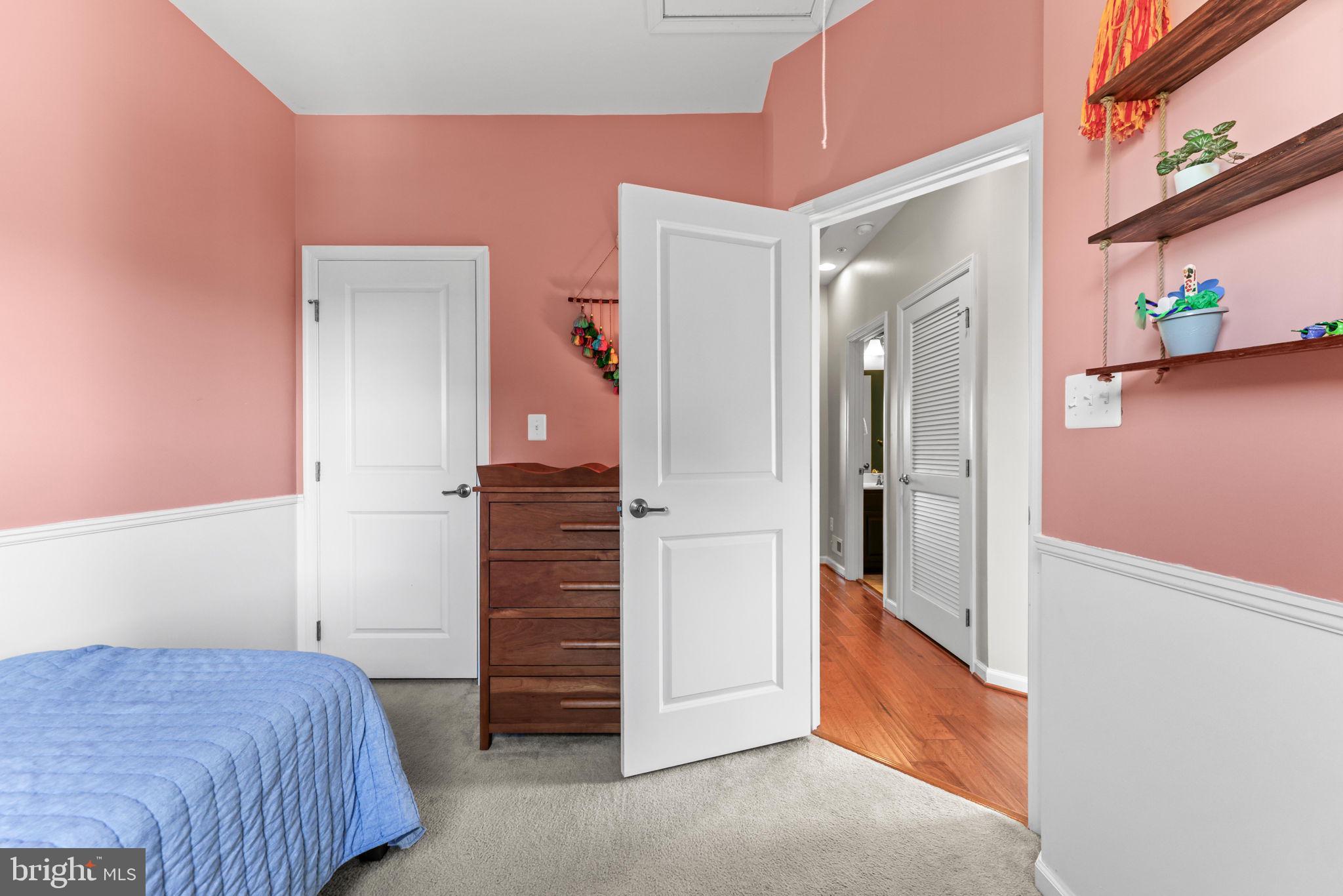 4648 Hudson Street Baltimore, MD 21224 - Photo 31 of 46 a bedroom with a bed and a dresser