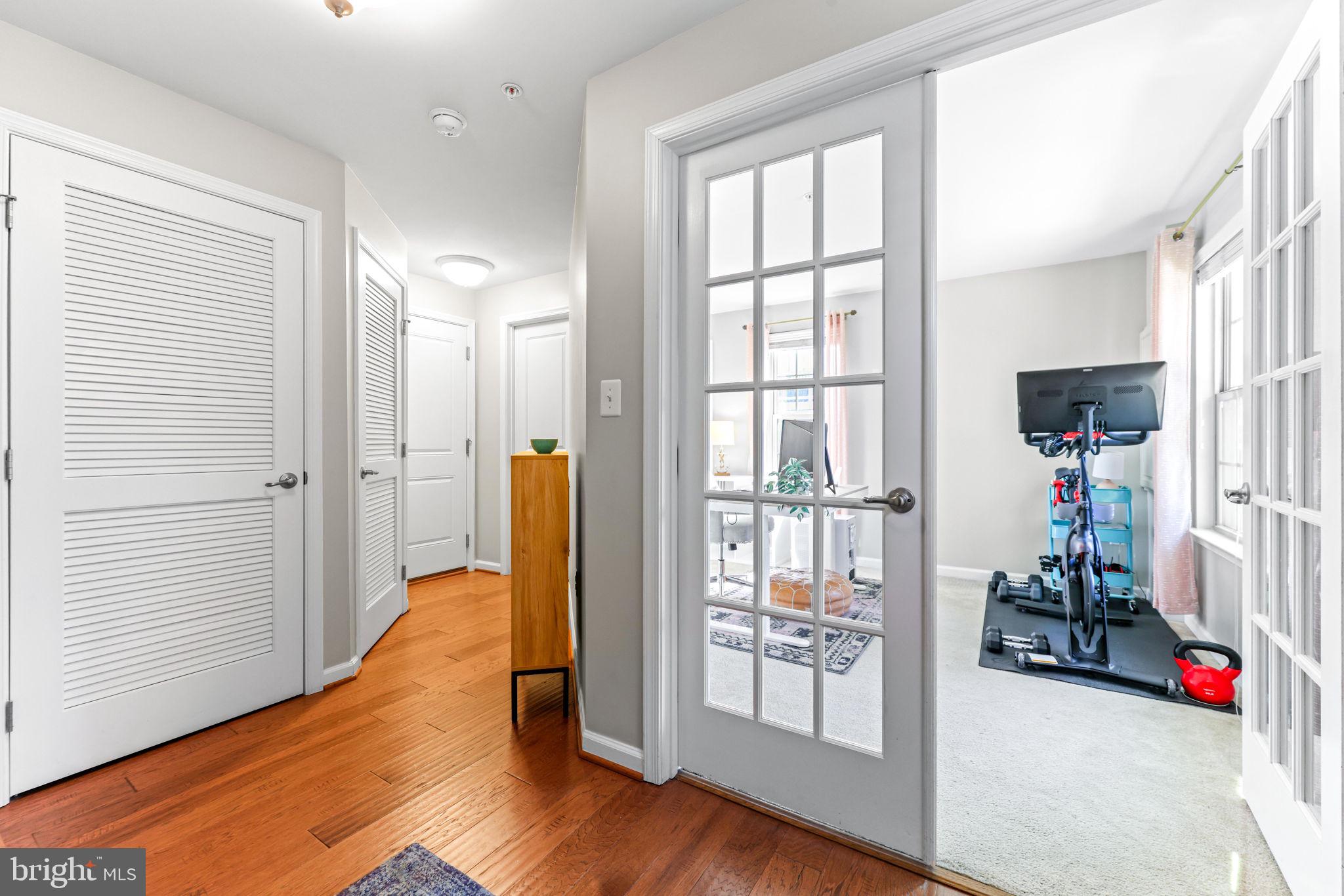 4648 Hudson Street Baltimore, MD 21224 - Photo 5 of 46 a view of walk in closet with clothes and shoes
