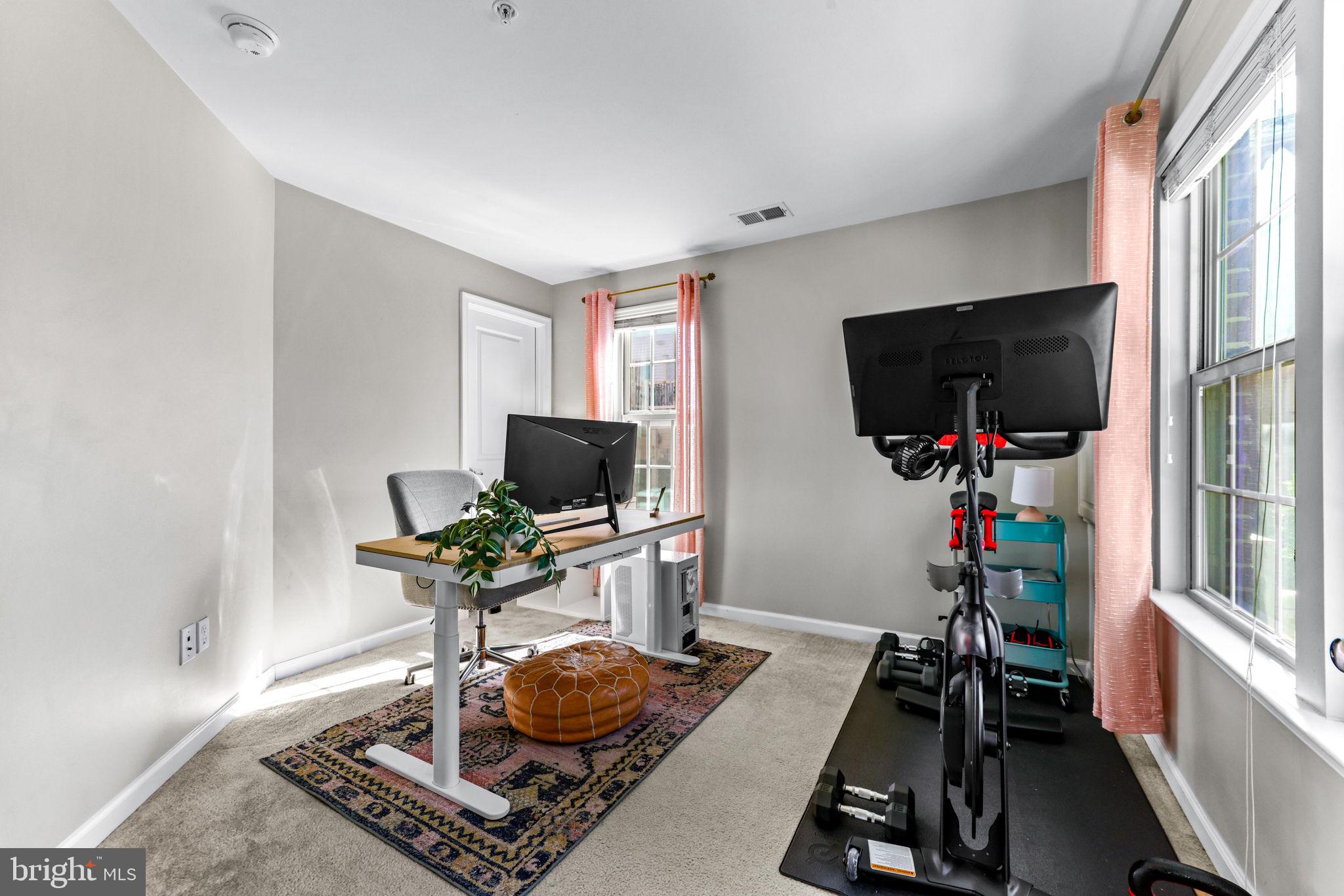 4648 Hudson Street Baltimore, MD 21224 - Photo 6 of 46 a room with furniture and a flat screen tv