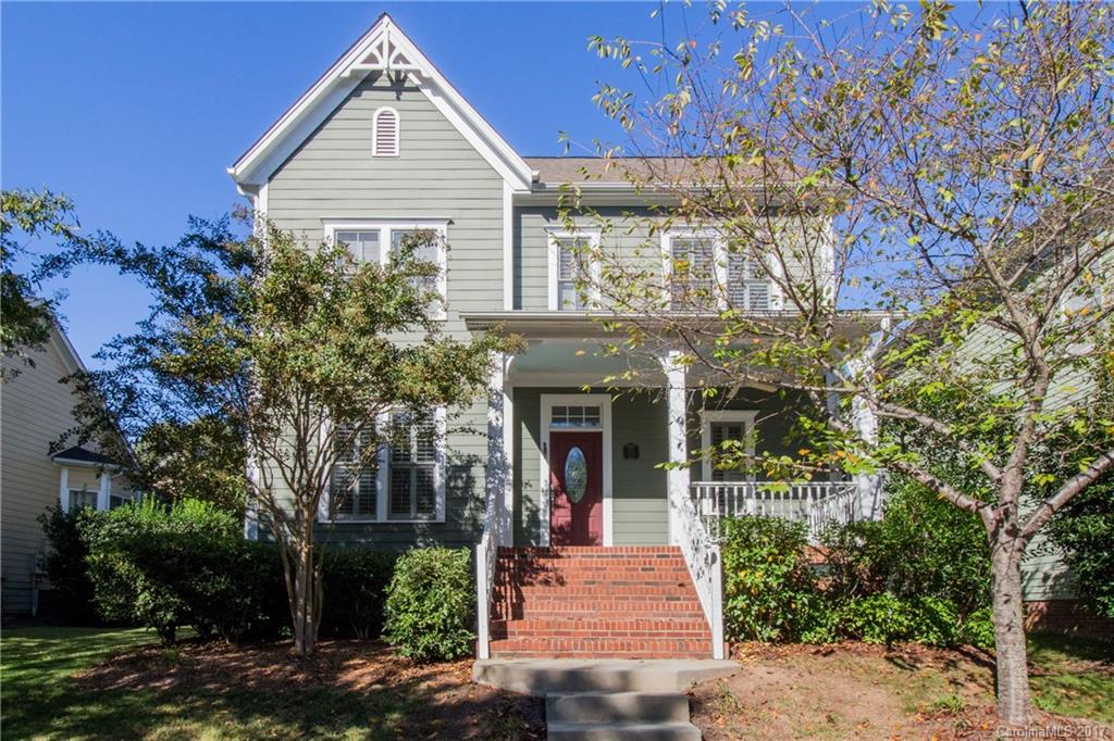 874 Promenade Walk, Unit 680 Fort Mill, SC 29708 - Photo 1 of 21 a front view of a house with a yard