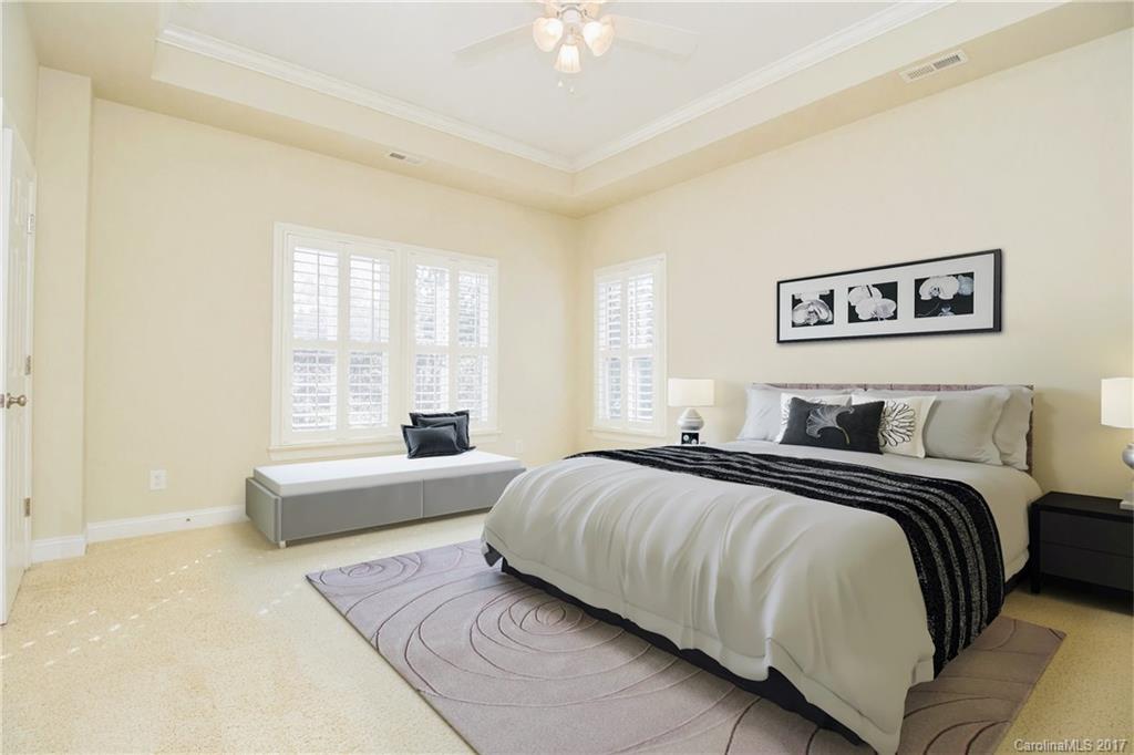 874 Promenade Walk, Unit 680 Fort Mill, SC 29708 - Photo 12 of 21 a bedroom with a bed and a couch