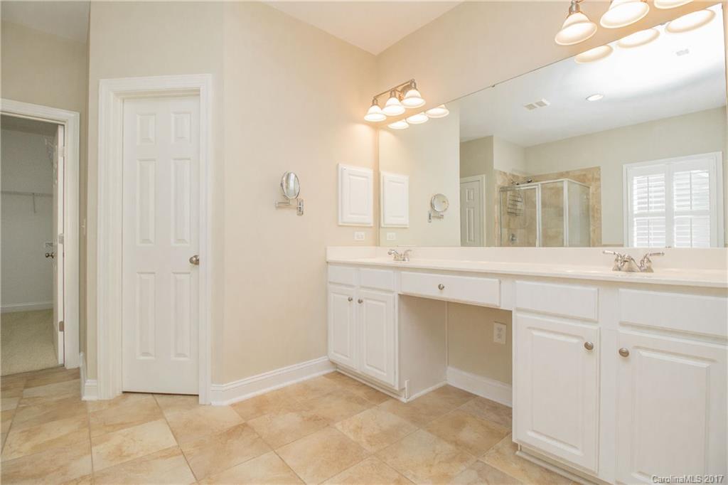 874 Promenade Walk, Unit 680 Fort Mill, SC 29708 - Photo 14 of 21 a spacious bathroom with a double vanity sink mirror and