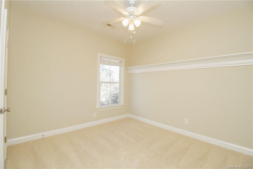 874 Promenade Walk, Unit 680 Fort Mill, SC 29708 - Photo 15 of 21 an empty room with a window and a fan