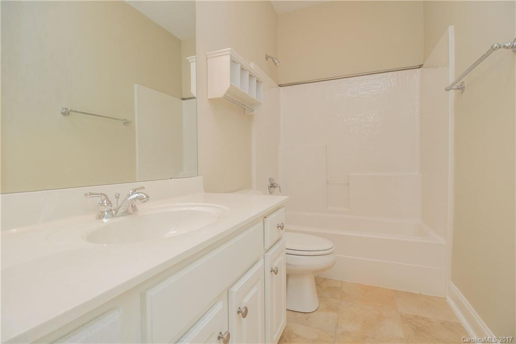 874 Promenade Walk, Unit 680 Fort Mill, SC 29708 - Photo 16 of 21 a bathroom with a sink a toilet and shower