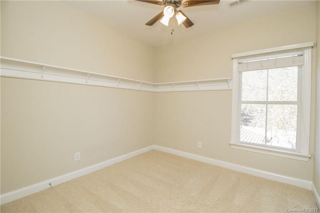 874 Promenade Walk, Unit 680 Fort Mill, SC 29708 - Photo 17 of 21 a view of an empty room with a window