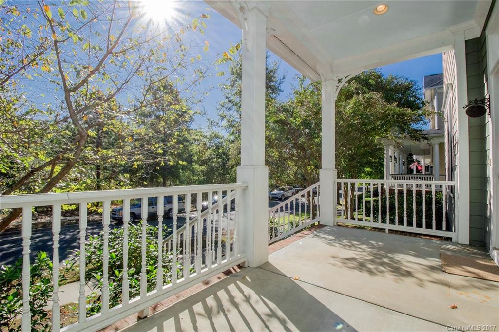 874 Promenade Walk, Unit 680 Fort Mill, SC 29708 - Photo 3 of 21 a view of a wooden deck next to a yard
