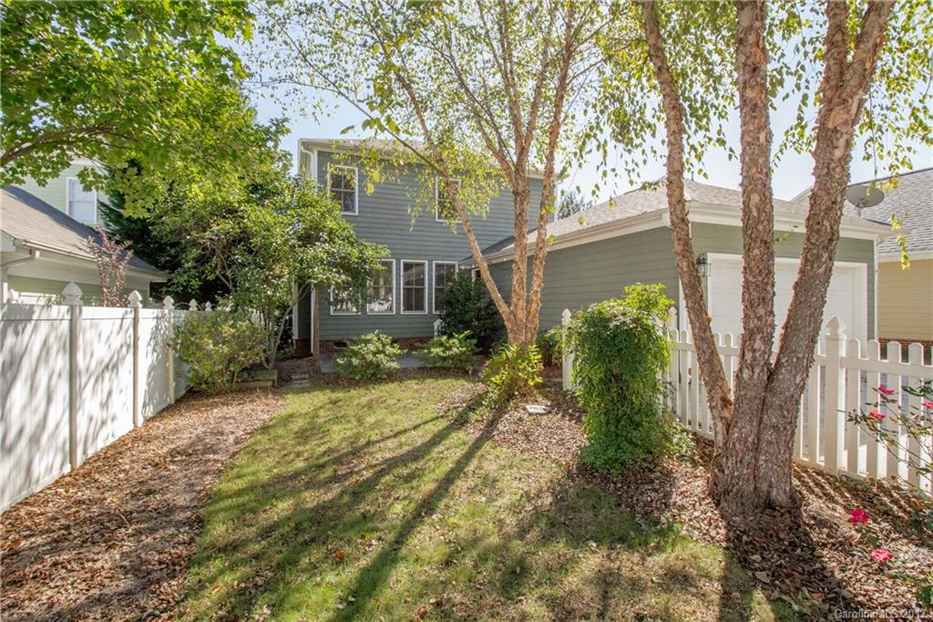 874 Promenade Walk, Unit 680 Fort Mill, SC 29708 - Photo 21 of 21 a front view of a house with a yard