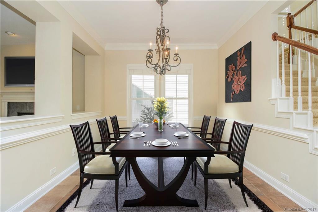 874 Promenade Walk, Unit 680 Fort Mill, SC 29708 - Photo 6 of 21 a view of a dining room with furniture window and wooden floor