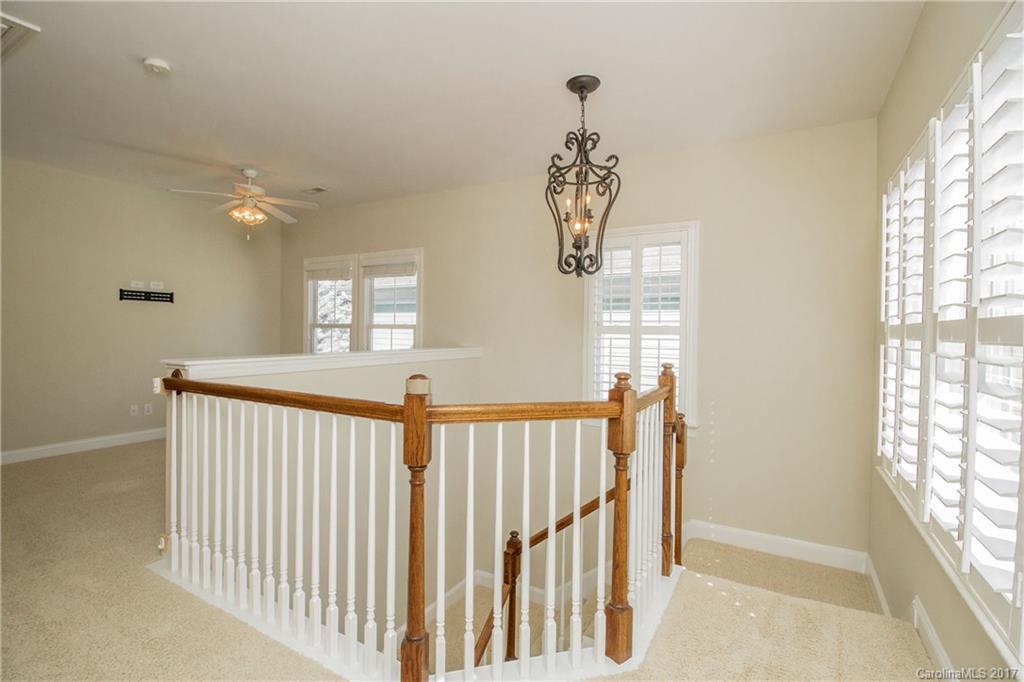 874 Promenade Walk, Unit 680 Fort Mill, SC 29708 - Photo 10 of 21 a view of a hallway with windows