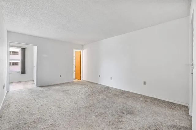 a view of an empty room and window